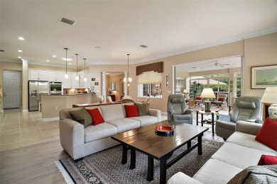 This pristine, expanded Hampton shows pride in ownership at on Eagle Ridge At Spruce Creek Country Club in Florida - for sale on GolfHomes.com, golf home, golf lot