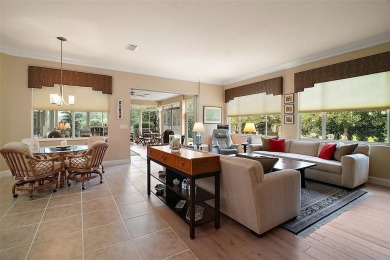 This pristine, expanded Hampton shows pride in ownership at on Eagle Ridge At Spruce Creek Country Club in Florida - for sale on GolfHomes.com, golf home, golf lot