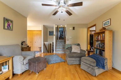 This is a home that checks all the boxes. Inside is a large well on Merrill Golf Club in Wisconsin - for sale on GolfHomes.com, golf home, golf lot