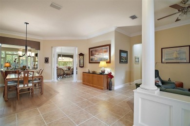 This pristine, expanded Hampton shows pride in ownership at on Eagle Ridge At Spruce Creek Country Club in Florida - for sale on GolfHomes.com, golf home, golf lot