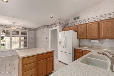 Just steps from the clubhouse, this expanded Palmera Model in on Oakwood Golf Club  in Arizona - for sale on GolfHomes.com, golf home, golf lot