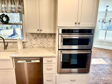 Experience unparalleled waterfront living in beautiful on Wedgefield Plantation Golf Club in South Carolina - for sale on GolfHomes.com, golf home, golf lot