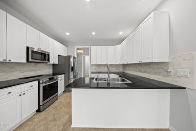 This beautifully updated 5-bedroom, 3-bathroom home offers a on The Neuse Golf Club in North Carolina - for sale on GolfHomes.com, golf home, golf lot