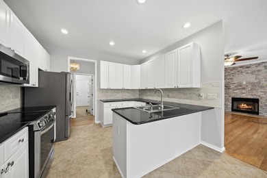 This beautifully updated 5-bedroom, 3-bathroom home offers a on The Neuse Golf Club in North Carolina - for sale on GolfHomes.com, golf home, golf lot