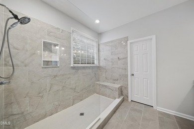 This beautifully updated 5-bedroom, 3-bathroom home offers a on The Neuse Golf Club in North Carolina - for sale on GolfHomes.com, golf home, golf lot