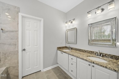 This beautifully updated 5-bedroom, 3-bathroom home offers a on The Neuse Golf Club in North Carolina - for sale on GolfHomes.com, golf home, golf lot