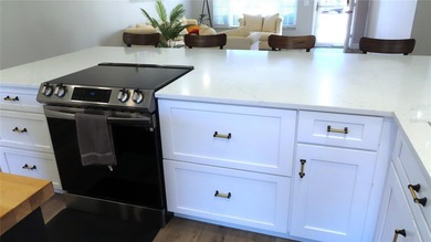 A move-in ready, beautifully remodeled, ground floor unit is on On Top Of The World Golf Course in Florida - for sale on GolfHomes.com, golf home, golf lot