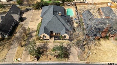 Welcome to Hollytree living in this  4BR/3BA estate spanning on Hollytree Country Club in Texas - for sale on GolfHomes.com, golf home, golf lot
