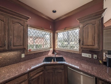 Welcome to Hollytree living in this  4BR/3BA estate spanning on Hollytree Country Club in Texas - for sale on GolfHomes.com, golf home, golf lot