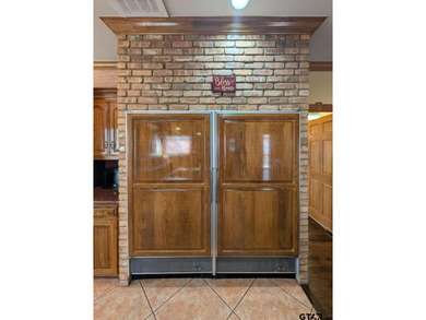 Welcome to Hollytree living in this  4BR/3BA estate spanning on Hollytree Country Club in Texas - for sale on GolfHomes.com, golf home, golf lot