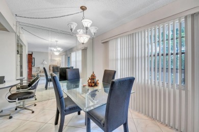 Spacious 2 bed, 2 bath condo in the popular Wynmoor community on Wynmoor Golf Course in Florida - for sale on GolfHomes.com, golf home, golf lot
