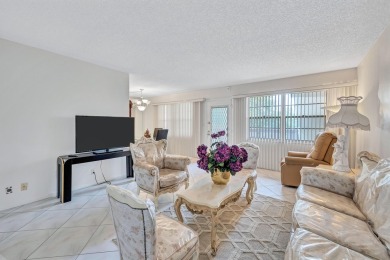 Spacious 2 bed, 2 bath condo in the popular Wynmoor community on Wynmoor Golf Course in Florida - for sale on GolfHomes.com, golf home, golf lot