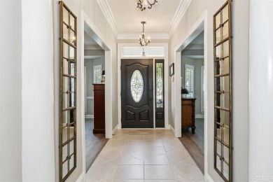 Beautifully updated and meticulously maintained lake front home on Tiger Point Golf and Country Club in Florida - for sale on GolfHomes.com, golf home, golf lot