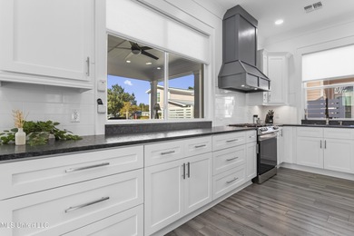 Your Perfect Coastal retreat! Steps from the beach, and easy on Pass Christian Isles Golf Club in Mississippi - for sale on GolfHomes.com, golf home, golf lot