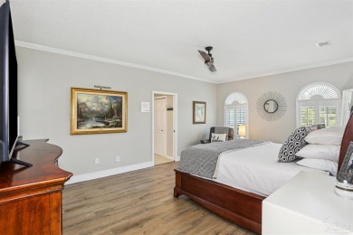 Beautifully updated and meticulously maintained lake front home on Tiger Point Golf and Country Club in Florida - for sale on GolfHomes.com, golf home, golf lot