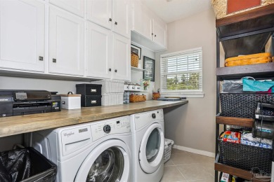 Beautifully updated and meticulously maintained lake front home on Tiger Point Golf and Country Club in Florida - for sale on GolfHomes.com, golf home, golf lot