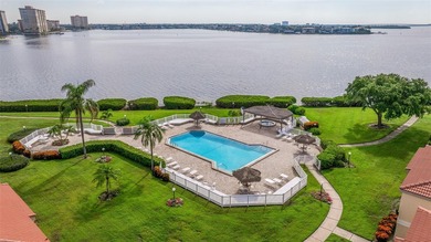 An abundance of natural light and updates in this welcoming on Isla Del Sol Yacht and Country Club in Florida - for sale on GolfHomes.com, golf home, golf lot