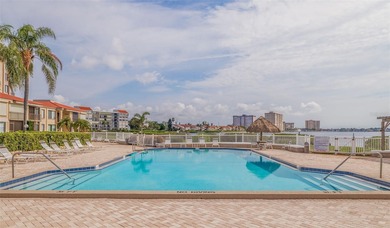 An abundance of natural light and updates in this welcoming on Isla Del Sol Yacht and Country Club in Florida - for sale on GolfHomes.com, golf home, golf lot