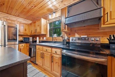 Nestled atop a gentle hill and surrounded by graceful Hemlocks on White Path Golf Club in Georgia - for sale on GolfHomes.com, golf home, golf lot