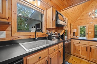 Nestled atop a gentle hill and surrounded by graceful Hemlocks on White Path Golf Club in Georgia - for sale on GolfHomes.com, golf home, golf lot