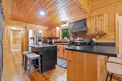 Nestled atop a gentle hill and surrounded by graceful Hemlocks on White Path Golf Club in Georgia - for sale on GolfHomes.com, golf home, golf lot