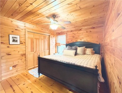 Nestled atop a gentle hill and surrounded by graceful Hemlocks on White Path Golf Club in Georgia - for sale on GolfHomes.com, golf home, golf lot