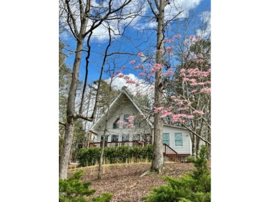 Nestled atop a gentle hill and surrounded by graceful Hemlocks on White Path Golf Club in Georgia - for sale on GolfHomes.com, golf home, golf lot