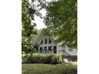 Nestled atop a gentle hill and surrounded by graceful Hemlocks on White Path Golf Club in Georgia - for sale on GolfHomes.com, golf home, golf lot