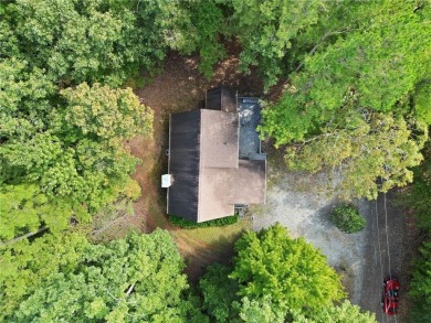 Nestled atop a gentle hill and surrounded by graceful Hemlocks on White Path Golf Club in Georgia - for sale on GolfHomes.com, golf home, golf lot