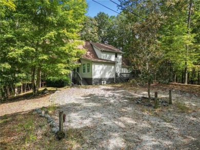 Nestled atop a gentle hill and surrounded by graceful Hemlocks on White Path Golf Club in Georgia - for sale on GolfHomes.com, golf home, golf lot