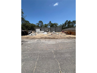Nestled in the heart of Citrus Springs, this residential on Citrus Springs Country Club in Florida - for sale on GolfHomes.com, golf home, golf lot