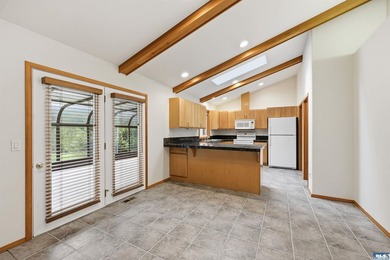 Peaceful Sunland golf course retreat with single-level living in on SunLand Golf and Country Club in Washington - for sale on GolfHomes.com, golf home, golf lot