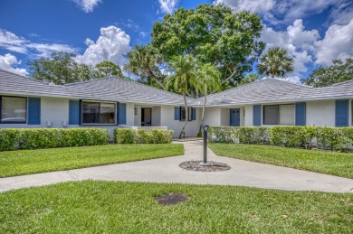 Located in the highly desirable Club Cottages community within on PGA National Golf Club in Florida - for sale on GolfHomes.com, golf home, golf lot
