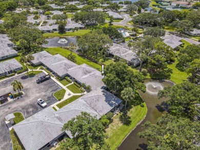Located in the highly desirable Club Cottages community within on PGA National Golf Club in Florida - for sale on GolfHomes.com, golf home, golf lot