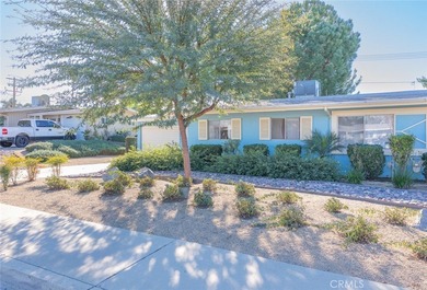 Inviting 55+ end-unit home located in the heart of Menifee on Cherry Hills Golf Club in California - for sale on GolfHomes.com, golf home, golf lot