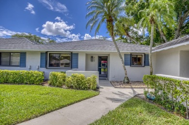 Located in the highly desirable Club Cottages community within on PGA National Golf Club in Florida - for sale on GolfHomes.com, golf home, golf lot