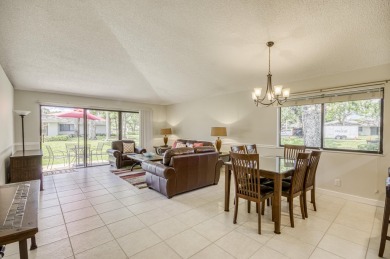 Located in the highly desirable Club Cottages community within on PGA National Golf Club in Florida - for sale on GolfHomes.com, golf home, golf lot