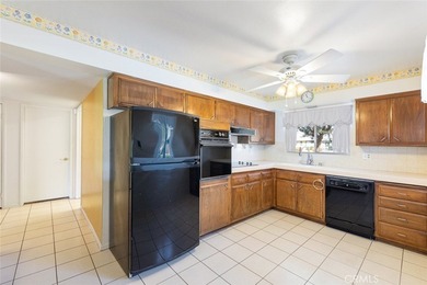 Inviting 55+ end-unit home located in the heart of Menifee on Cherry Hills Golf Club in California - for sale on GolfHomes.com, golf home, golf lot