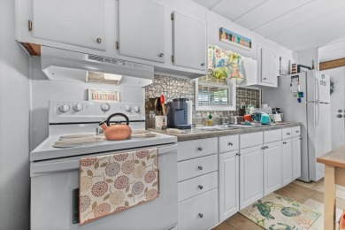 Welcome to a charming 3-bedroom, 2-bathroom home nestled in the on Barefoot Resort and Golf Club  in South Carolina - for sale on GolfHomes.com, golf home, golf lot