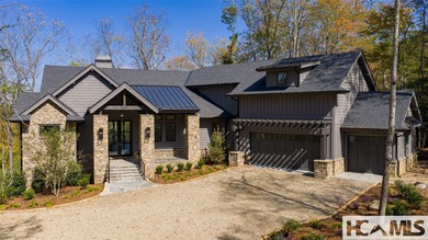 Nestled within the gates of Wildcat Cliffs Country Club but part on Wildcat Cliffs Country Club in North Carolina - for sale on GolfHomes.com, golf home, golf lot