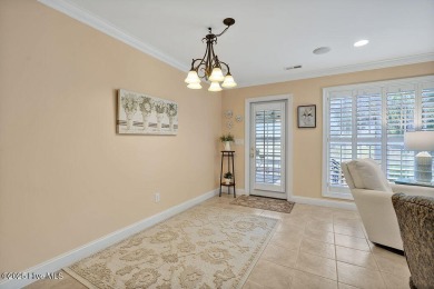 Enjoy serene pond views with this stunning brick home located in on Cape Fear National At Brunswick Forest in North Carolina - for sale on GolfHomes.com, golf home, golf lot