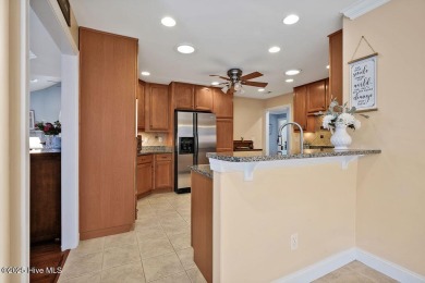 Enjoy serene pond views with this stunning brick home located in on Cape Fear National At Brunswick Forest in North Carolina - for sale on GolfHomes.com, golf home, golf lot