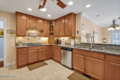 Enjoy serene pond views with this stunning brick home located in on Cape Fear National At Brunswick Forest in North Carolina - for sale on GolfHomes.com, golf home, golf lot