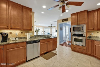 Enjoy serene pond views with this stunning brick home located in on Cape Fear National At Brunswick Forest in North Carolina - for sale on GolfHomes.com, golf home, golf lot