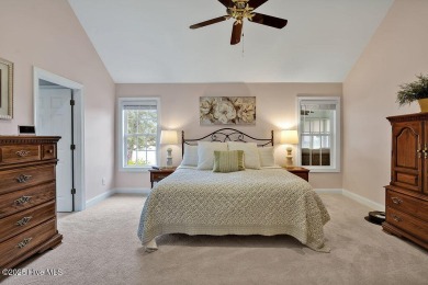 Enjoy serene pond views with this stunning brick home located in on Cape Fear National At Brunswick Forest in North Carolina - for sale on GolfHomes.com, golf home, golf lot