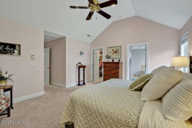 Enjoy serene pond views with this stunning brick home located in on Cape Fear National At Brunswick Forest in North Carolina - for sale on GolfHomes.com, golf home, golf lot