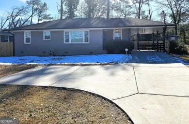 Welcome to this charming 3-bedroom, 2-bath home in the heart of on Charlie Yates Golf Course in Georgia - for sale on GolfHomes.com, golf home, golf lot