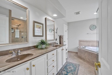 Enjoy serene pond views with this stunning brick home located in on Cape Fear National At Brunswick Forest in North Carolina - for sale on GolfHomes.com, golf home, golf lot