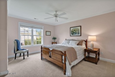 Enjoy serene pond views with this stunning brick home located in on Cape Fear National At Brunswick Forest in North Carolina - for sale on GolfHomes.com, golf home, golf lot