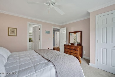 Enjoy serene pond views with this stunning brick home located in on Cape Fear National At Brunswick Forest in North Carolina - for sale on GolfHomes.com, golf home, golf lot